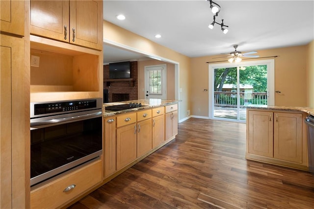 kitchen with dark wood finished floors, ceiling fan, black electric stovetop, and oven