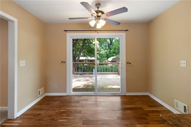 entryway featuring ceiling fan, visible vents, and wood finished floors