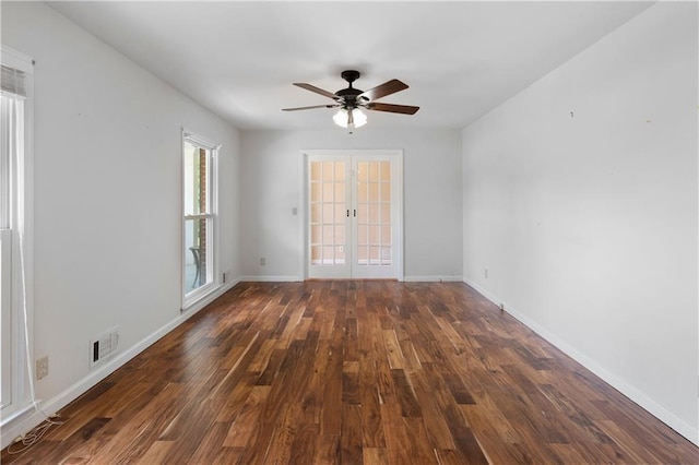unfurnished room featuring ceiling fan, french doors, baseboards, wood finished floors, and visible vents