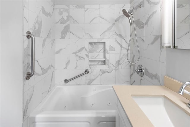 bathroom with vanity and a combined bath / shower with jetted tub