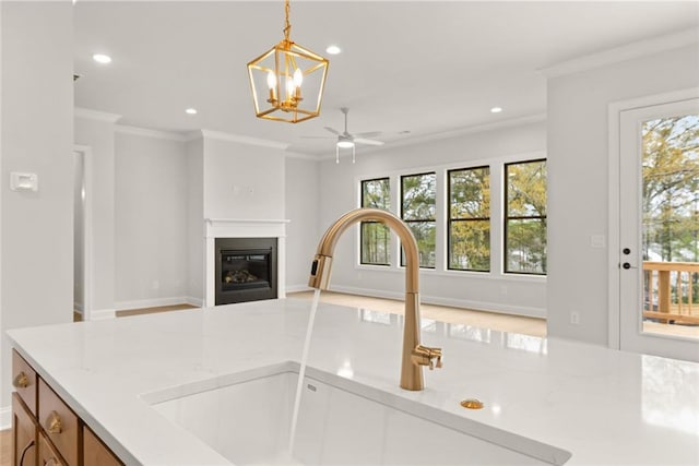 5424 Gallagher Ct, Powder Springs, GA 30127 - kitchen featuring a sink, recessed lighting, a chandelier, pendant lighting, and ceiling fan