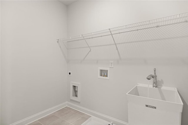 5424 Gallagher Ct, Powder Springs, GA 30127 - laundry room with hookup for an electric dryer, washer hookup, baseboards, and light tile patterned flooring