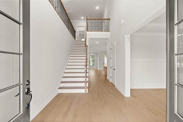5424 Gallagher Ct, Powder Springs, GA 30127 - foyer entrance with ornamental molding, wood finished floors, stairs, recessed lighting, and a high ceiling