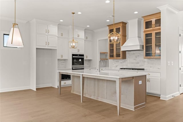 5424 Gallagher Ct, Powder Springs, GA 30127 - kitchen featuring premium range hood, light countertops, gas stovetop, decorative backsplash, and recessed lighting