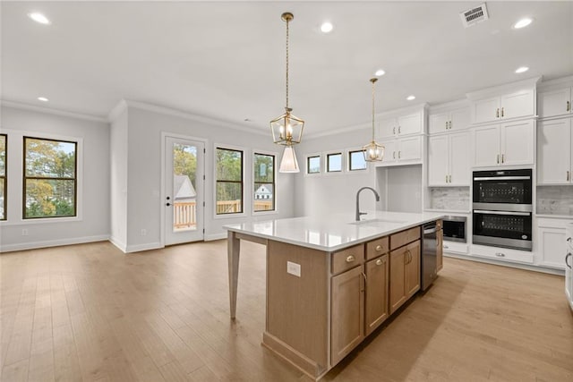 5424 Gallagher Ct, Powder Springs, GA 30127 - kitchen with a sink, appliances with stainless steel finishes, light countertops, crown molding, and recessed lighting