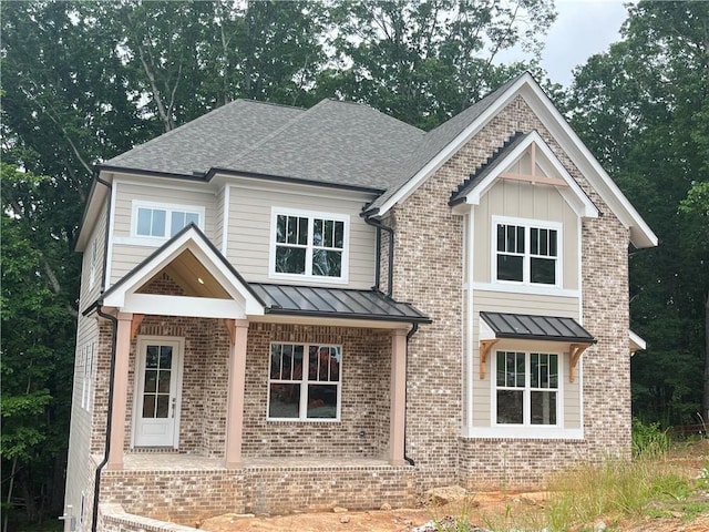 1025 Liberty Springs Dr, Woodstock, GA 30188 - craftsman-style house with a standing seam roof, brick siding, and roof with shingles