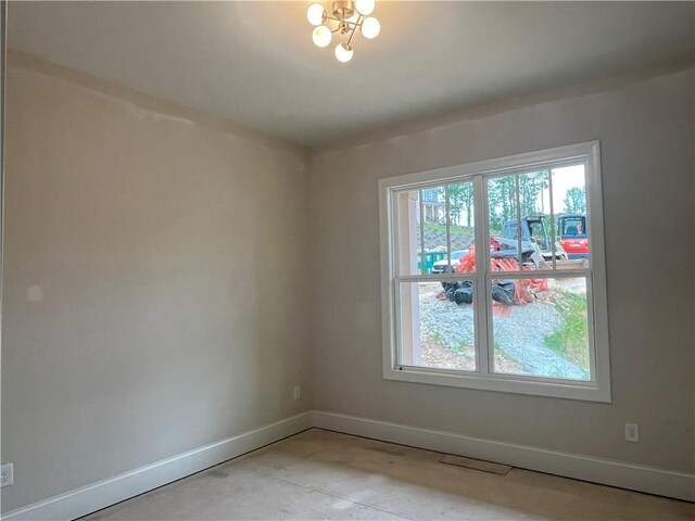 1025 Liberty Springs Dr, Woodstock, GA 30188 - spare room featuring healthy amount of natural light and a chandelier