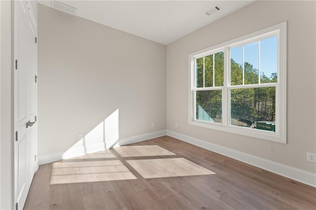 1025 Liberty Springs Dr, Woodstock, GA 30188 - spare room featuring wood finished floors