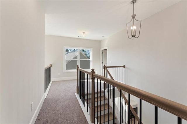1025 Liberty Springs Dr, Woodstock, GA 30188 - hall with an upstairs landing, carpet flooring, and a chandelier