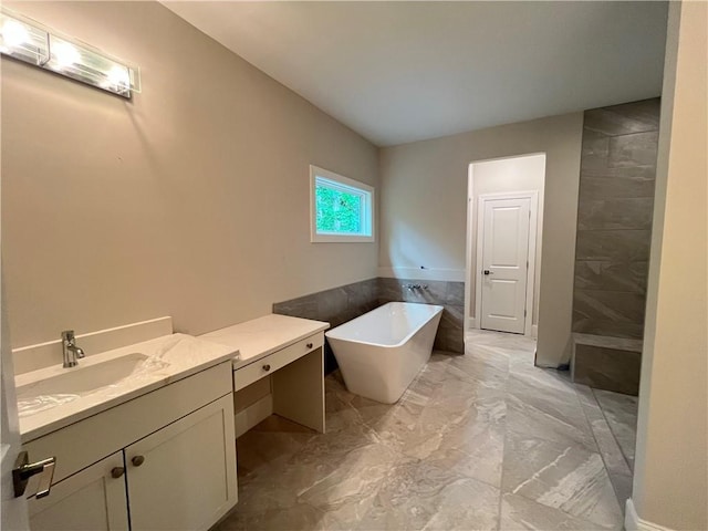 1025 Liberty Springs Dr, Woodstock, GA 30188 - bathroom featuring marble finish floors, a soaking tub, vanity, and tiled shower