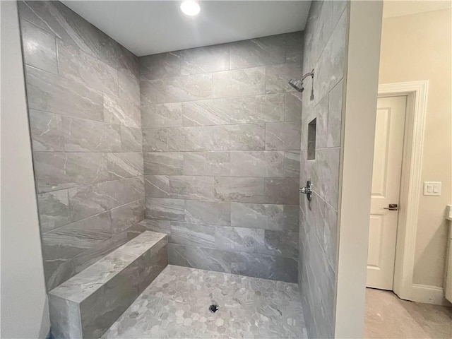1025 Liberty Springs Dr, Woodstock, GA 30188 - bathroom featuring a tile shower and recessed lighting