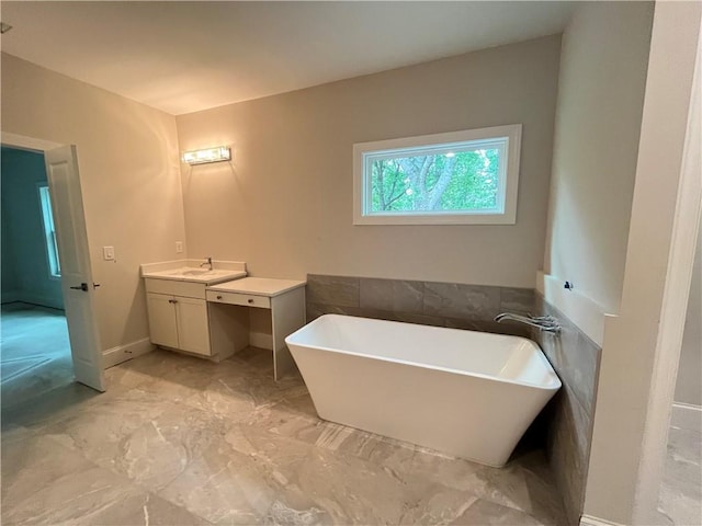 1025 Liberty Springs Dr, Woodstock, GA 30188 - full bath featuring vanity, a freestanding bath, and marble look tiles