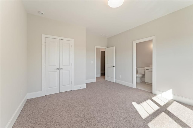 1025 Liberty Springs Dr, Woodstock, GA 30188 - unfurnished bedroom featuring light carpet, a closet, and connected bathroom