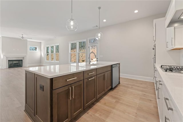 1025 Liberty Springs Dr, Woodstock, GA 30188 - kitchen featuring stainless steel appliances, a ceiling fan, white cabinets, light countertops, and recessed lighting