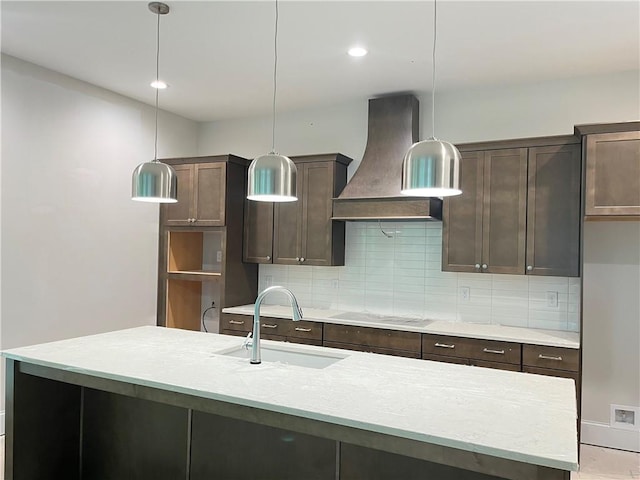 1025 Liberty Springs Dr, Woodstock, GA 30188 - kitchen with wall chimney exhaust hood, stovetop, dark brown cabinets, and recessed lighting