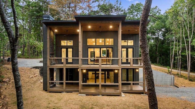 back of house with ceiling fan