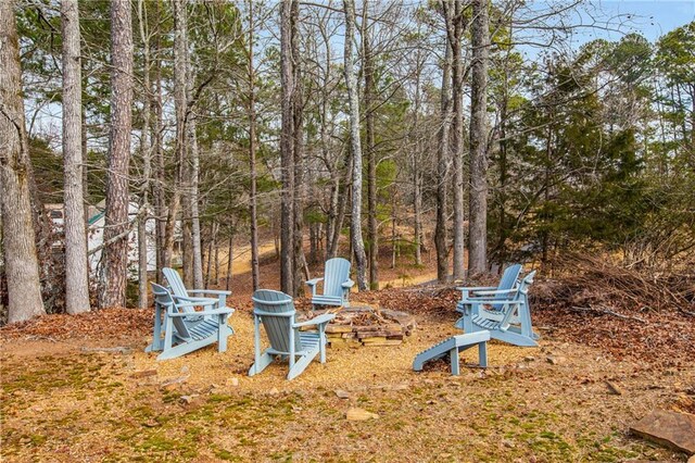 view of yard with a fire pit