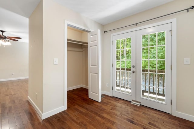 interior space with ceiling fan, dark hardwood / wood-style flooring, and french doors