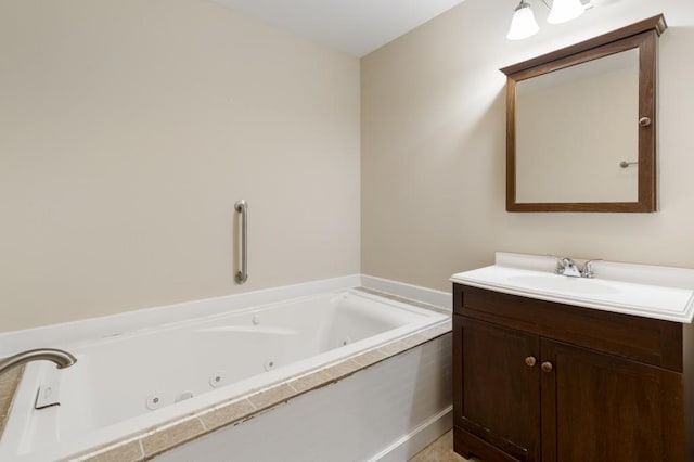 bathroom featuring vanity and a bath