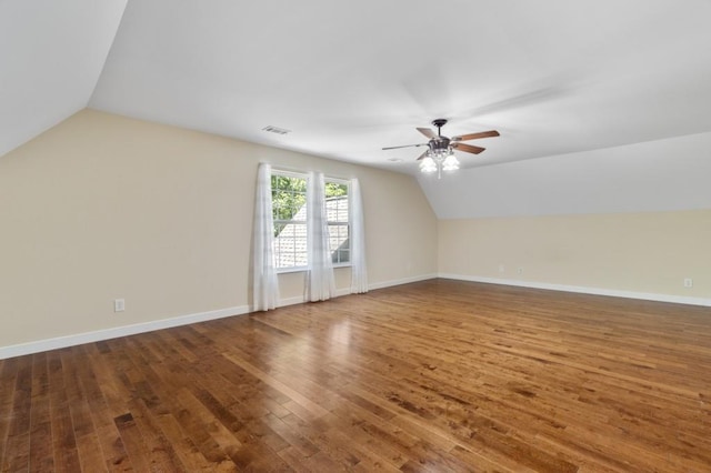 bonus room featuring wood-type flooring, vaulted ceiling, and ceiling fan