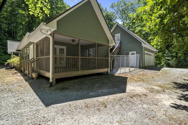 back of property featuring a sunroom