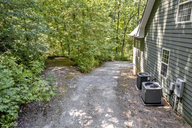 view of yard featuring central air condition unit