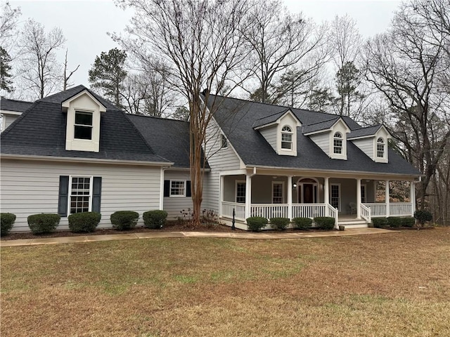 cape cod-style house with a front yard