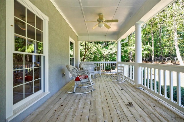 wooden deck with ceiling fan and a porch