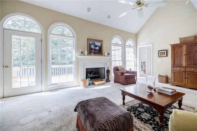 living room featuring carpet floors, ceiling fan, high vaulted ceiling, and a healthy amount of sunlight