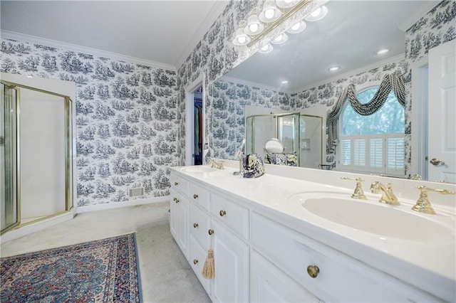 bathroom with crown molding, vanity, and a shower with shower door