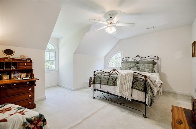 carpeted bedroom featuring ceiling fan and lofted ceiling