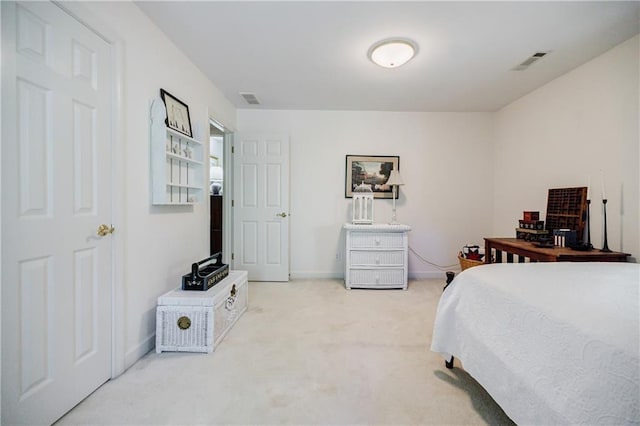 bedroom with light colored carpet