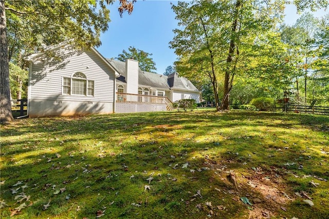 view of yard with a wooden deck