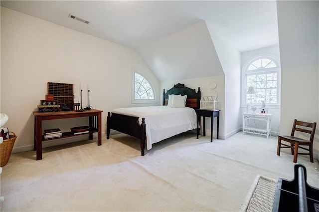 carpeted bedroom featuring lofted ceiling