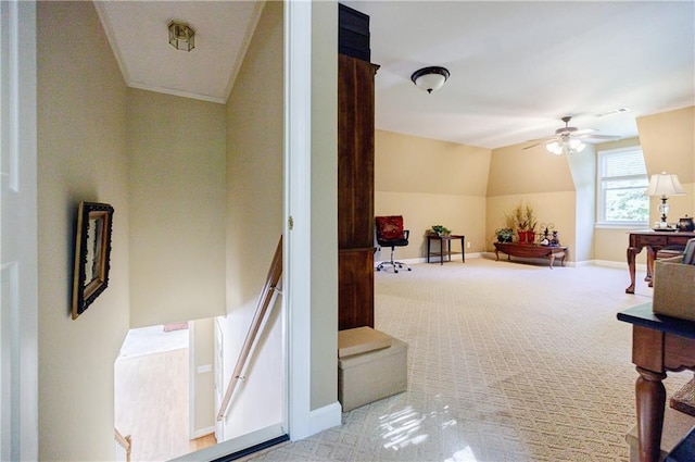 interior space with light colored carpet, ceiling fan, and lofted ceiling