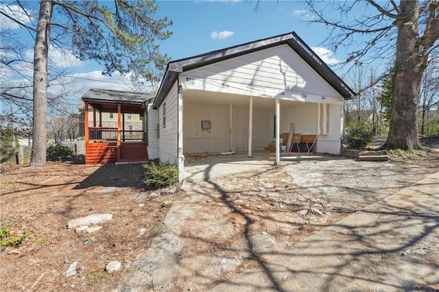 exterior space featuring driveway and a carport