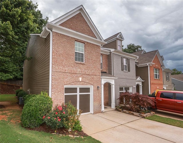 5260 Sherwood Way, Cumming, GA 30040 - view of front of property with driveway, brick siding, an attached garage, and central AC unit