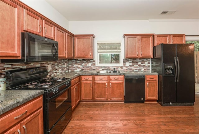 5260 Sherwood Way, Cumming, GA 30040 - kitchen with black appliances, a sink, dark wood finished floors, and tasteful backsplash