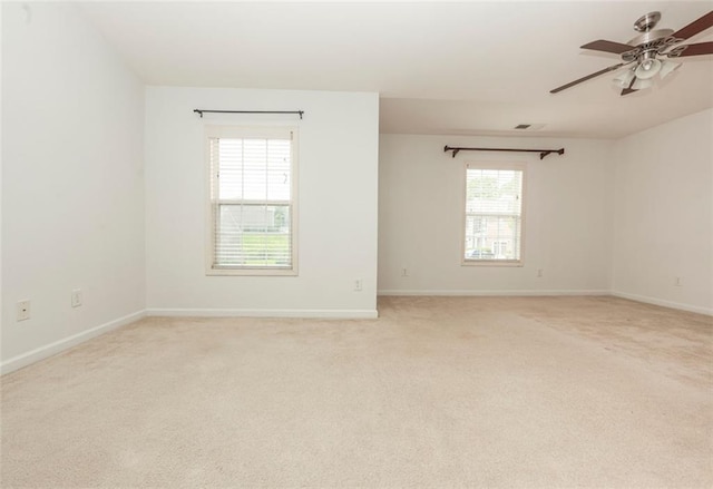 5260 Sherwood Way, Cumming, GA 30040 - spare room with light colored carpet, a ceiling fan, and baseboards