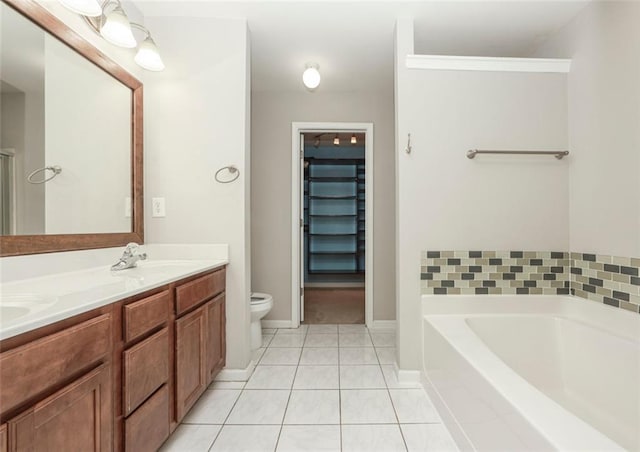 5260 Sherwood Way, Cumming, GA 30040 - full bathroom with toilet, a garden tub, double vanity, tile patterned floors, and baseboards