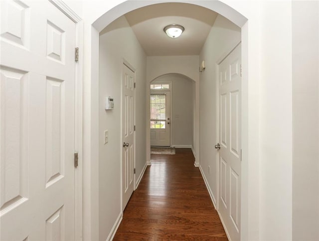 5260 Sherwood Way, Cumming, GA 30040 - hall featuring dark wood-style flooring, baseboards, and arched walkways