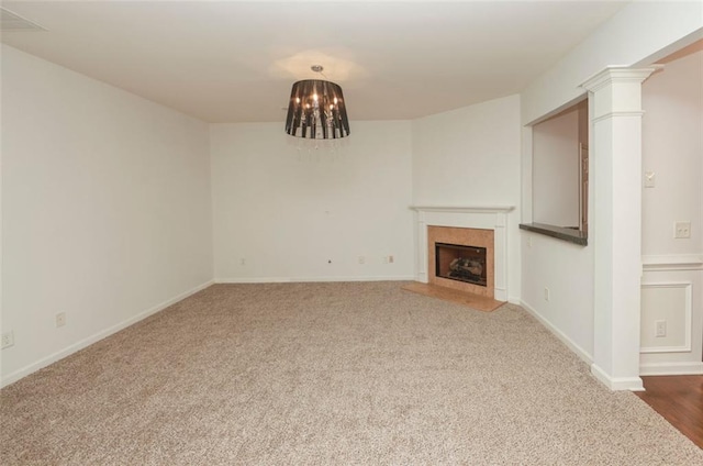 5260 Sherwood Way, Cumming, GA 30040 - unfurnished living room featuring carpet floors, a fireplace with flush hearth, baseboards, and decorative columns