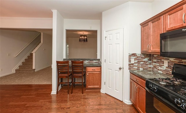 5260 Sherwood Way, Cumming, GA 30040 - kitchen featuring black appliances, brown cabinetry, and dark wood-type flooring
