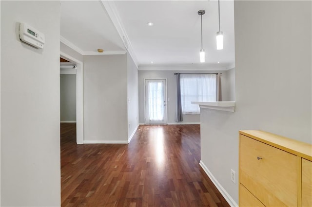 entrance foyer featuring dark hardwood / wood-style floors and crown molding