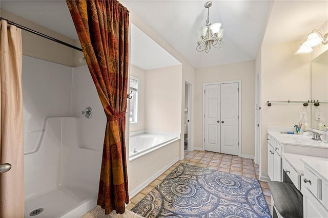 bathroom featuring vanity, independent shower and bath, and a chandelier