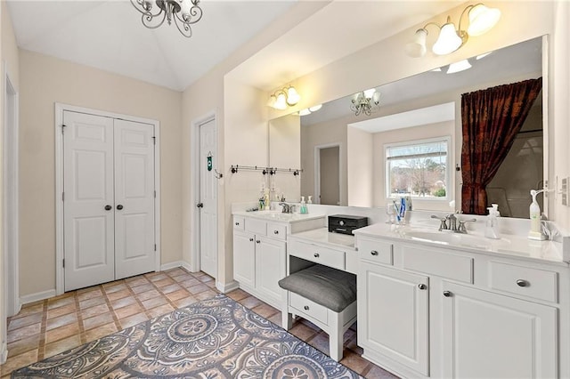 bathroom featuring vanity and an inviting chandelier