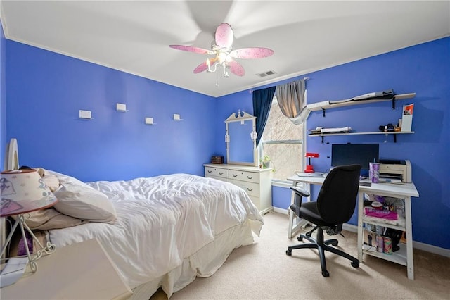 carpeted bedroom with ceiling fan