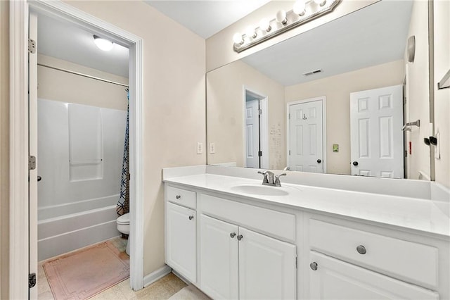 full bathroom with shower / bath combo with shower curtain, vanity, and toilet