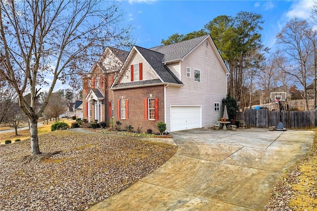 view of side of property with a garage