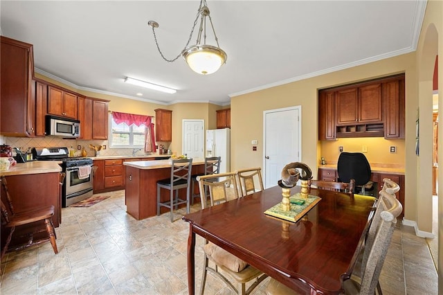 dining room featuring ornamental molding